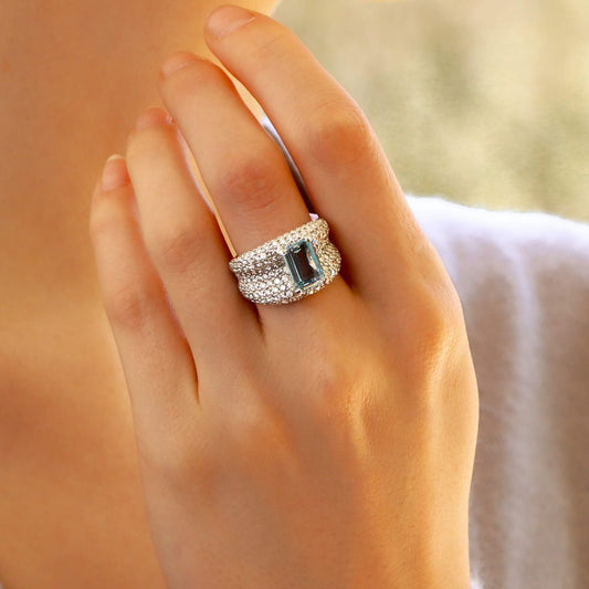 An incredibly sparkly 1.93ct emerald cut aquamarine and diamond bombe ring set in 18ct white gold.