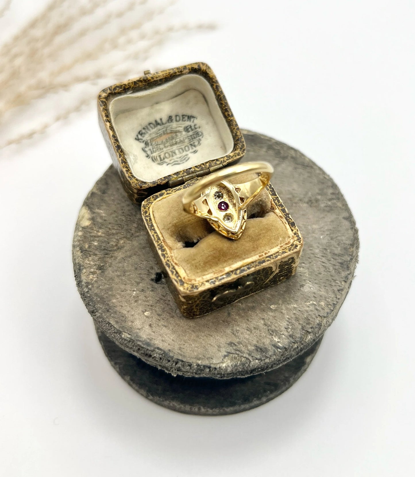 A navette shaped pearl, diamond and ruby cluster ring in yellow gold, in a ring box