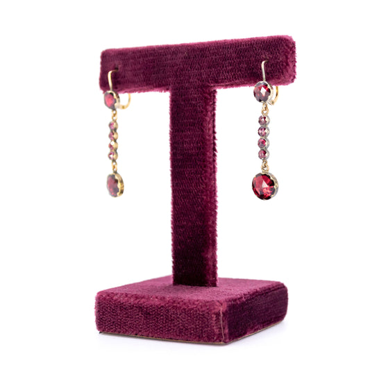 A pair of drop earrings with garnets in yellow gold