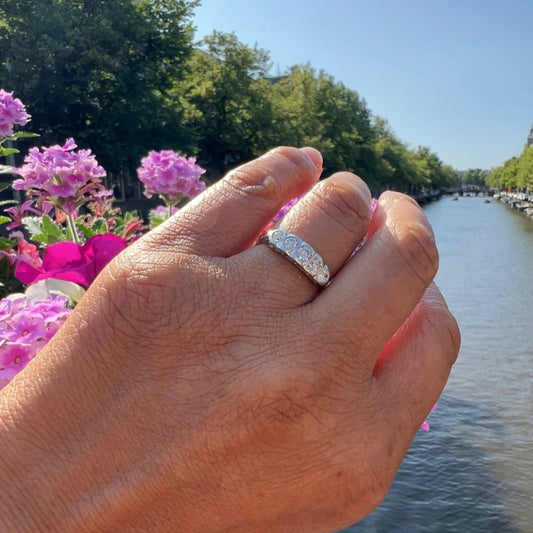 A five stone diamond ring in platinum, modelled on a hand