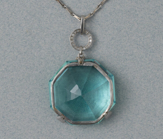 Georges Fouquet Art Deco 80ct Octagonal Aquamarine Pendant; in three rose-cut diamond-set platinum prongs, Signed by Master mark of Fouquet, Circa 1920.