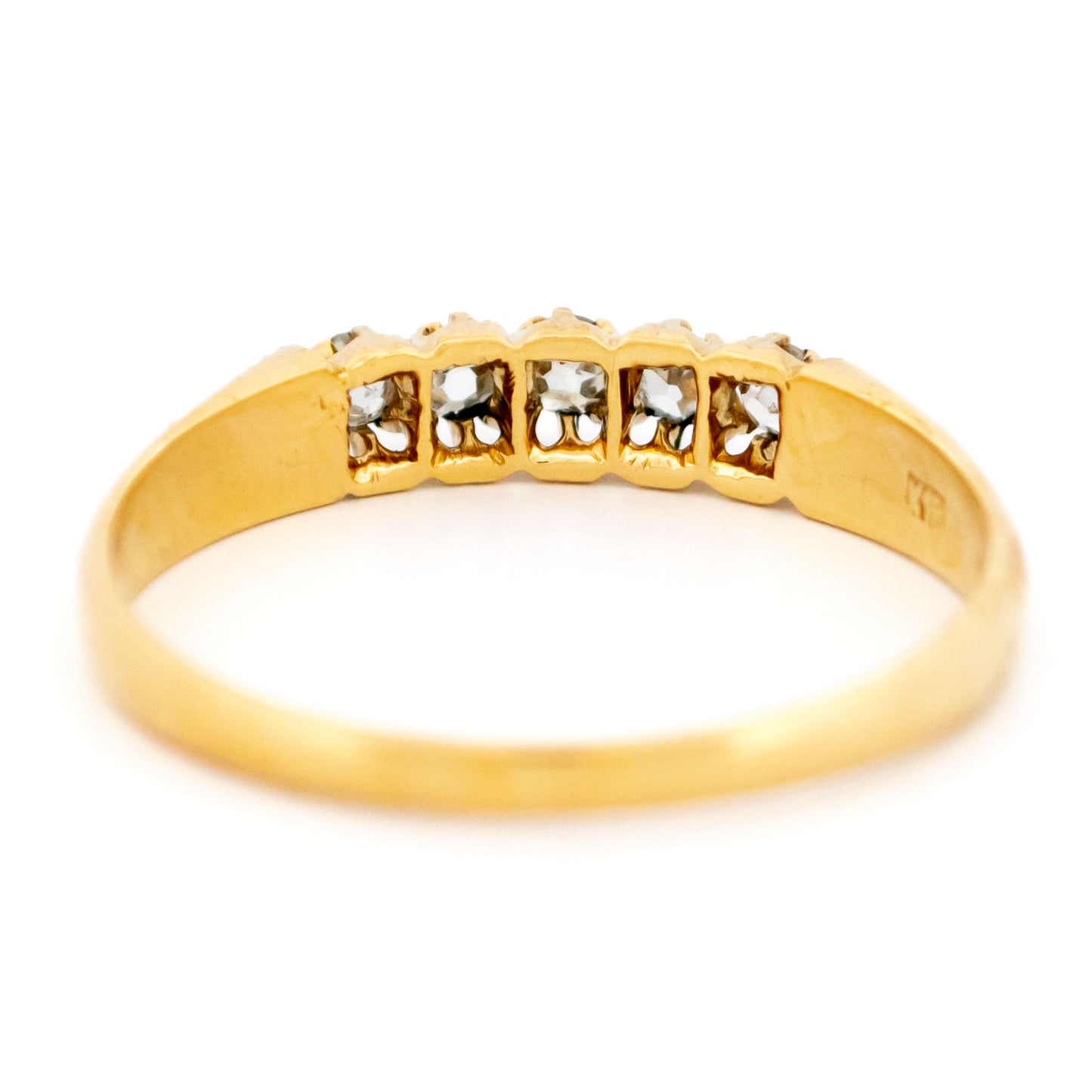 A five stone diamond ring in yellow gold
