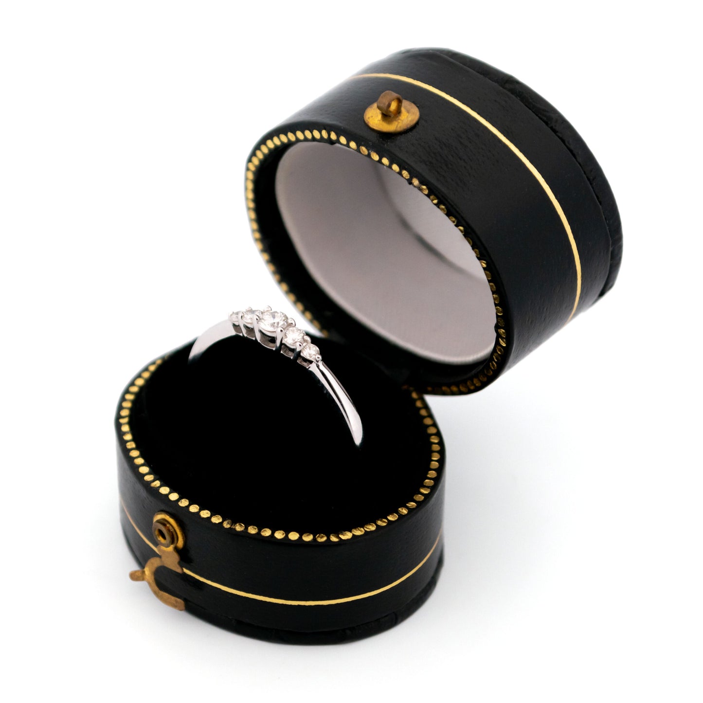 A graduated five stone diamond ring in white gold, in a ring box