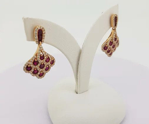 Ruby and Diamond Cluster Drop Earrings; set with 1.50cts rubies encompassed by 0.70cts diamonds, in the shape of a fan, 18ct yellow gold.