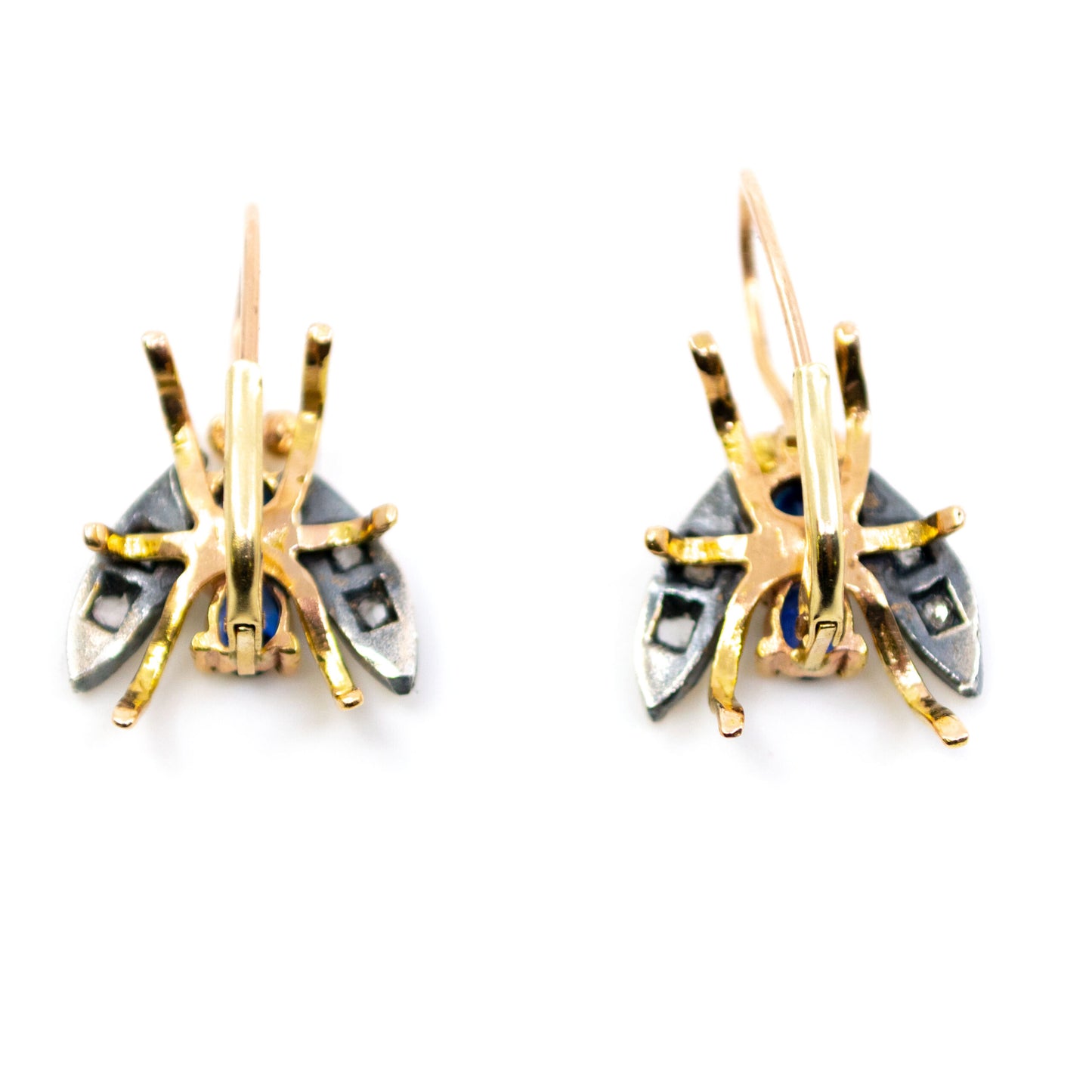 A pair of insect earrings in yellow gold and silver with sapphires and diamonds