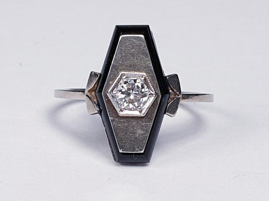 Art Deco French Old Cut Diamond and Onyx Lozenge Plaque Ring; hexagonal ring with central 0.25ct old cut diamond on a matt ground with a fine onyx border. Set in white gold, Circa 1925
