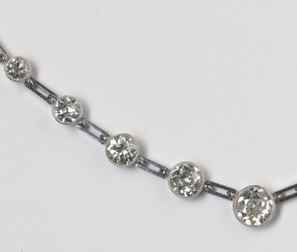 Art Deco Graduated Old Cut Diamond Necklace, 10 carats, thirty-two old-cut diamonds, collet-set with millegrain border, gate-bar links, 18ct white gold.