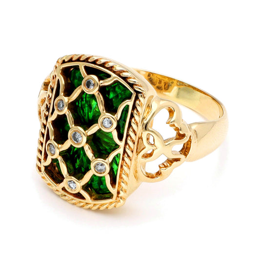 A yellow gold ring with green enamel and round diamonds set into a trellis design, against a white background
