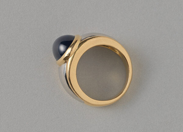 Vintage 11.87ct Cabochon Sapphire, Gold and Platinum Dress Ring; set with an oval cabochon-cut 11.87 carat natural untreated sapphire. France