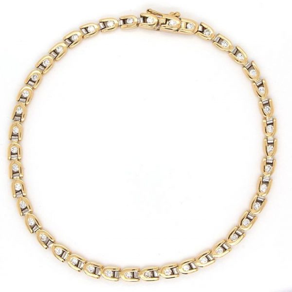 Contemporary 1.20ct Diamond Line Bracelet in 18ct Yellow Gold; set with 42 round brilliant-cut diamond totalling 1.20 carats, secured by a tongue and groove clasp with figure-of-eight safety catch