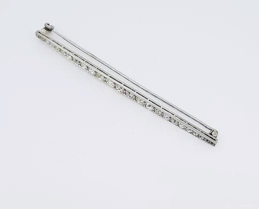 Antique Edwardian 2.20ct Diamond and Platinum Bar Brooch; set with 2.20 carats graduating diamonds, 5.5cm long.