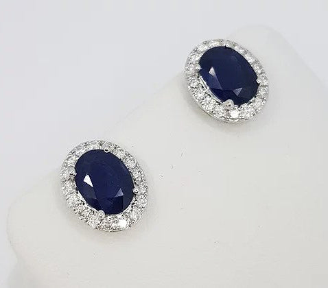 Sapphire and Diamond Oval Cluster Stud Earrings; 2.97cts oval faceted sapphires with brilliant cut diamond surround, 18ct white gold.