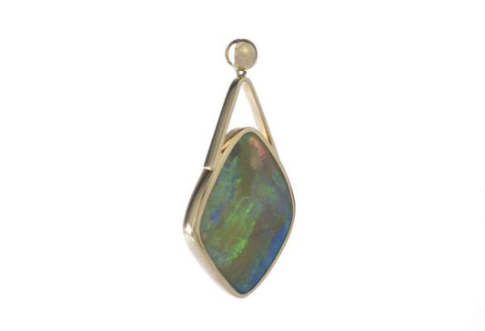 Vintage 25.00ct Opal Pendant in 18ct Yellow Gold; striking 25 carat opal of cushioned diamond shaped form, in 18ct yellow gold, Circa 1950-1970s