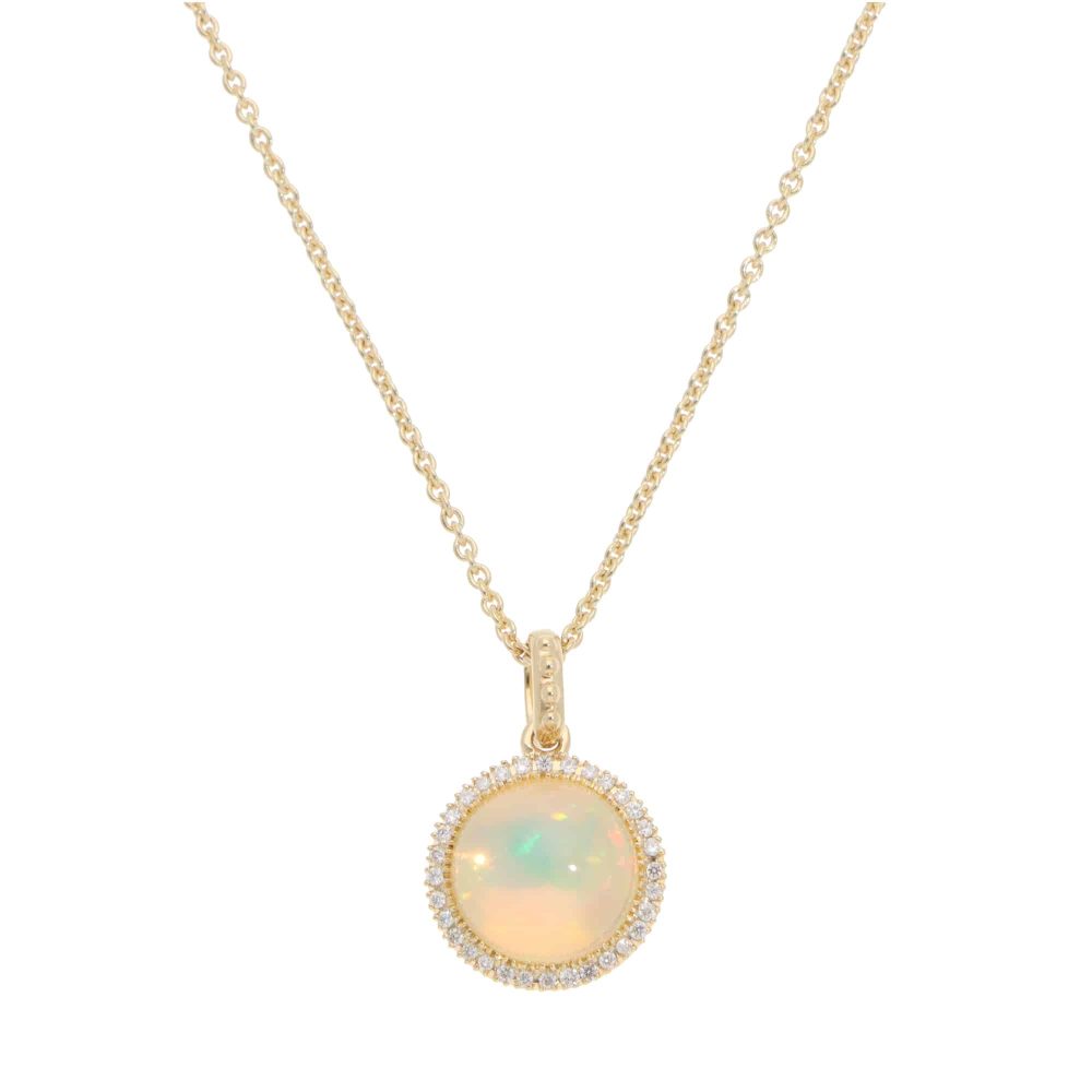 Opal and diamond pendant necklace in gold.