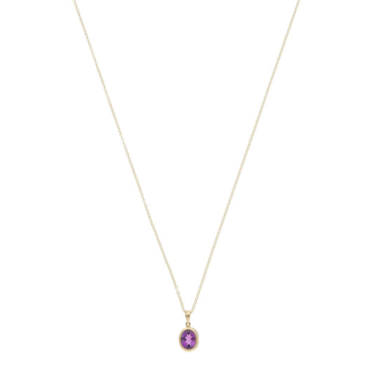 A yellow gold amethyst pendant on a gold chain, on a white background