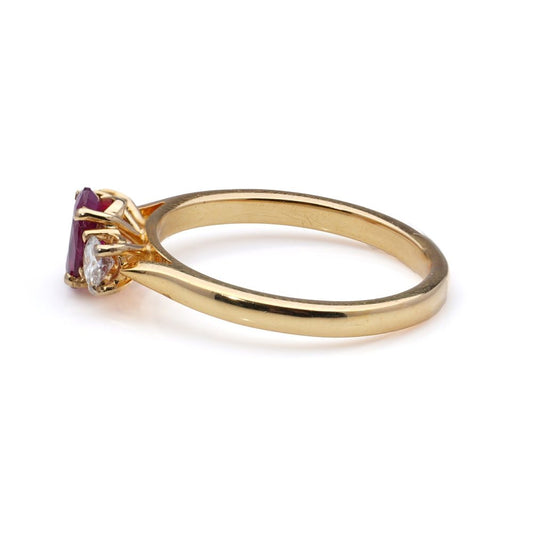 Three-stone diamond and ruby ring in 18 carat yellow gold.