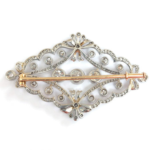 Antique Edwardian Old Cut Diamond Brooch, set with old European-cut diamonds within a rose cut diamond border designed as a quatrefoil of bows in platinum upon gold