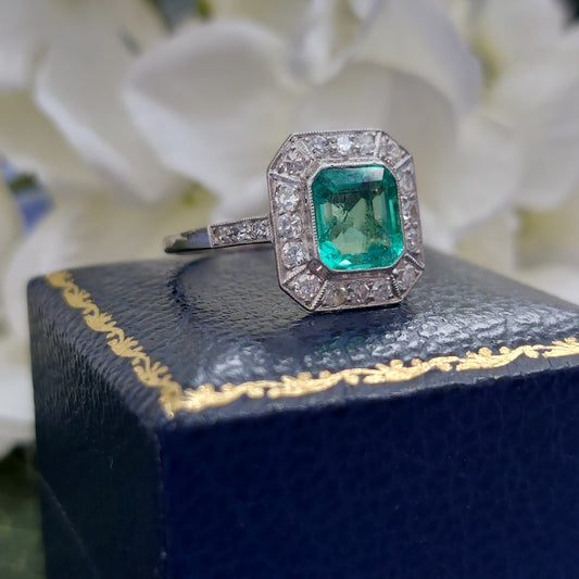 Vintage emerald and diamond engagement ring