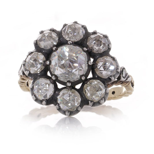 Antique Diamond daisy cluster ring in gold and silver.