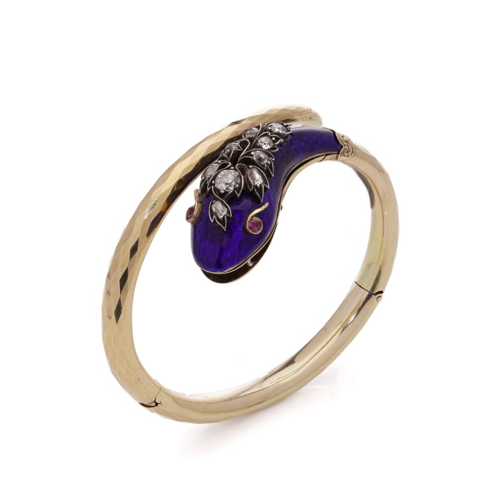 Gold and silver snake serpent bangle with diamonds.