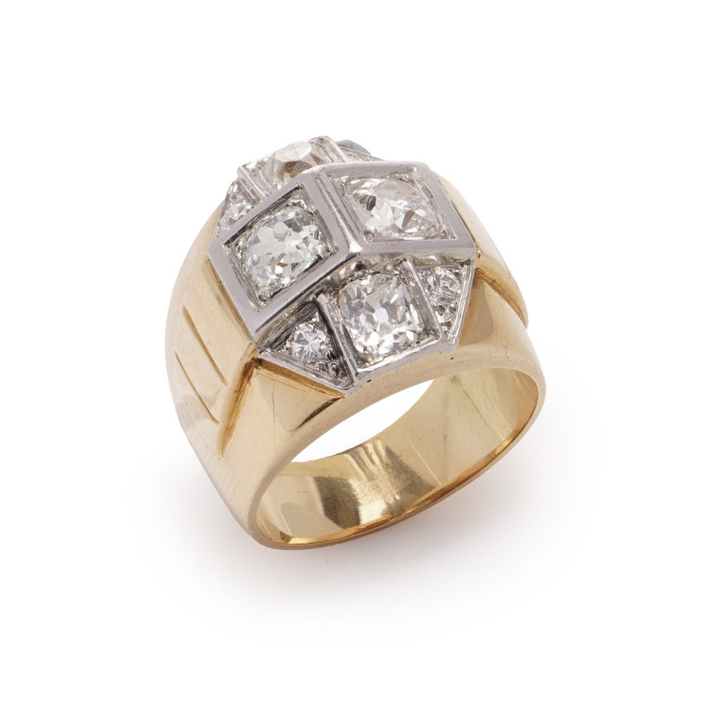 Diamond dome ring in gold and platinum.