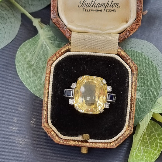 Vintage 1940s Retro 16cts Cushion Cut Yellow Sapphire Ring with Blue Sapphire and Diamond Shoulders in Platinum