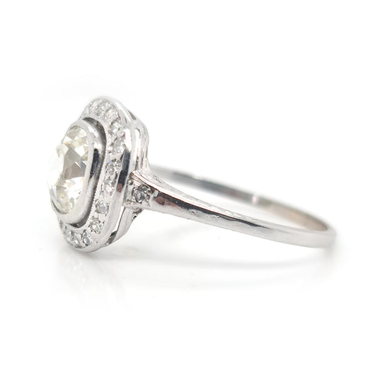 Antique 1.50ct Cushion Old Cut Diamond Halo Cluster Engagement Ring in platinum. Circa 1900s