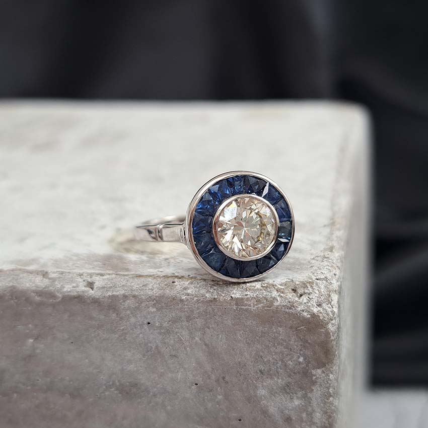 1.21ct Diamond and Calibre Sapphire Target Engagement Ring