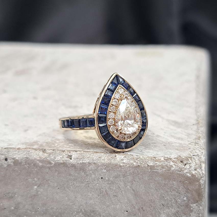 1ct Pear Cut Diamond and Sapphire Target Cluster Engagement Ring