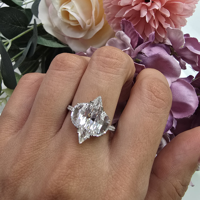 Fine Marquise Diamond Ring with Half Moon Shoulders, 1.67ct marquise-cut diamond flanked by a half moon diamond either side in platinum with single cut diamonds set to the gallery and three outer edges of the shank
