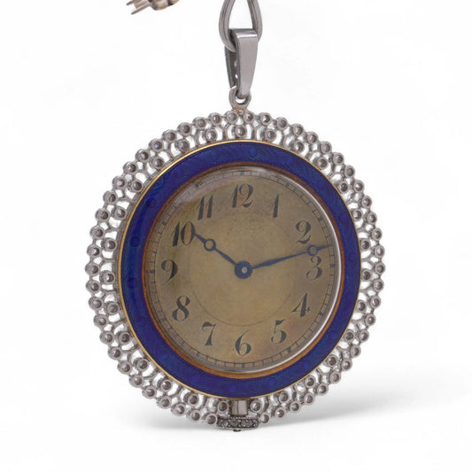 A blue enamel pendant pocket watch in silver with a dark coloured dial and black Arabic numbers, on a white background