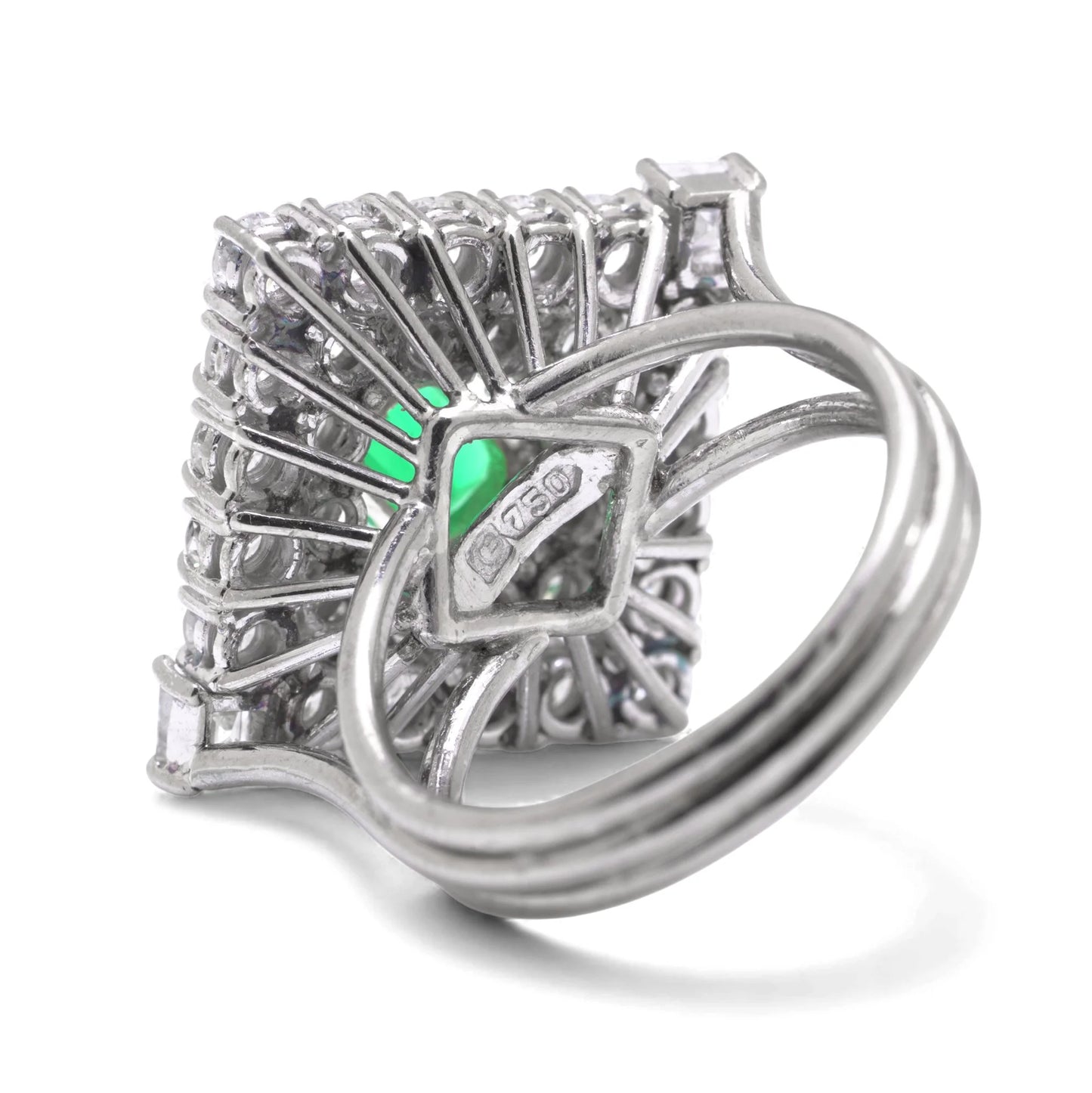 An emerald and diamond square shaped cluster ring in white gold, stamped 750, on a white background