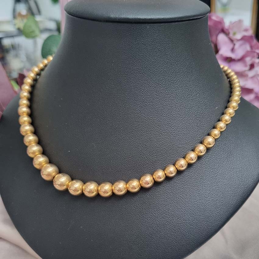 Vintage Graduating Yellow Gold Bead Necklace, underlying chain strung with polished 14ct yellow gold beads measuring from 9.5mm to 4.5mm. Circa 1930s