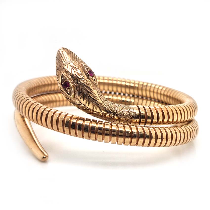 Vintage 9ct Yellow Gold Coiled Snake Bracelet, The coiled serpent's body wraps around the wearer's wrist. Circa 1970's. Hallmarks: Birmingham 9ct gold hallmarks, date letter worn, OJ makers mark