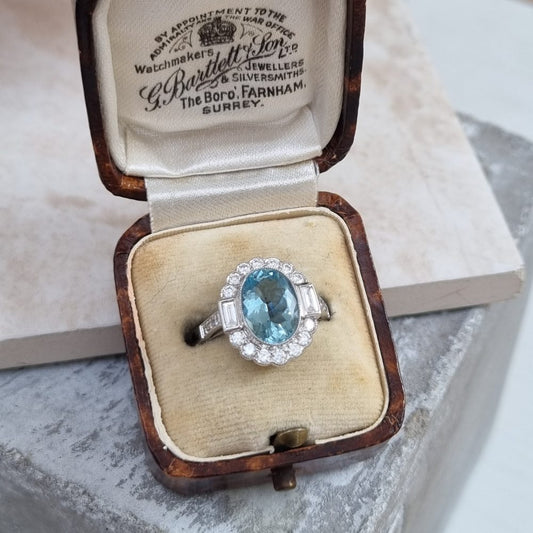 Oval Cut 2.10ct Aquamarine and Diamond Cluster Engagement Ring