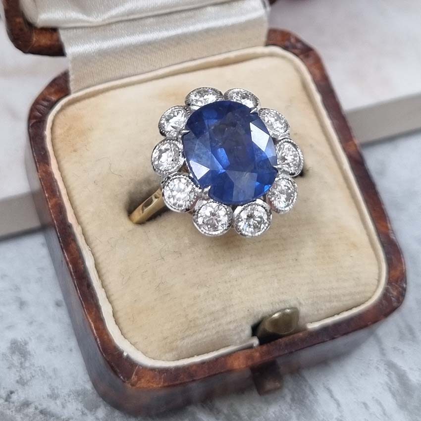 4.62ct Oval Sapphire and Diamond Flower Cluster Engagement Ring