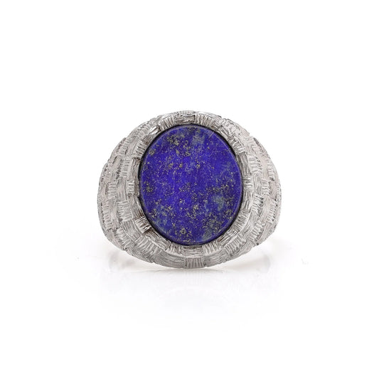 A white gold textured ring with an oval lapis lazuli