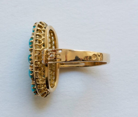 Antique Victorian Cabochon Turquoise, Diamond and Gold Oval Plaque Ring; 18ct yellow gold oval ring set with eight cabochon cut turquoises accented with nine rose cut diamonds. France, 19th century