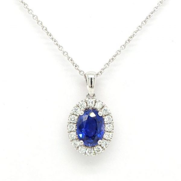 Sapphire and Diamond Oval Cluster Pendant; central 1.08ct oval faceted sapphire surrounded by 0.19cts brilliant cut diamonds, 18ct white gold