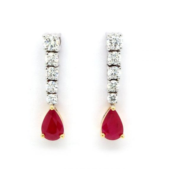 Pear Cut Ruby and Diamond Drop Earrings; pear-cut rubies hung from a row of five graduating brilliant cut diamonds. Sapphires 0.97cts. Diamonds 0.54cts
