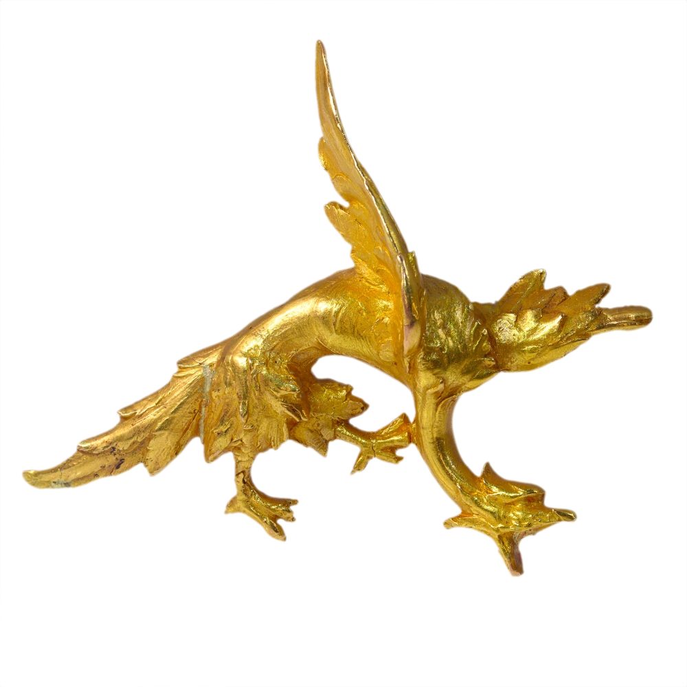 Antique gold griffin brooch.