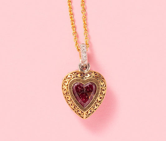 An Early 20th Century 18ct Ruby & Diamond Heart Locket
