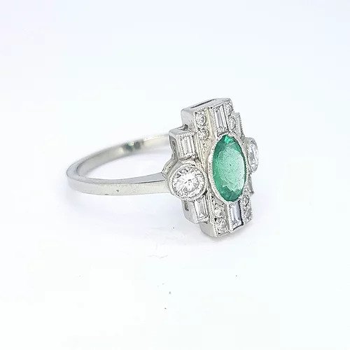 Art Deco Style Emerald and Diamond Plaque Ring; 0.77ct oval emerald surrounded by 0.60cts baguette and round cut diamonds, in 18ct white gold