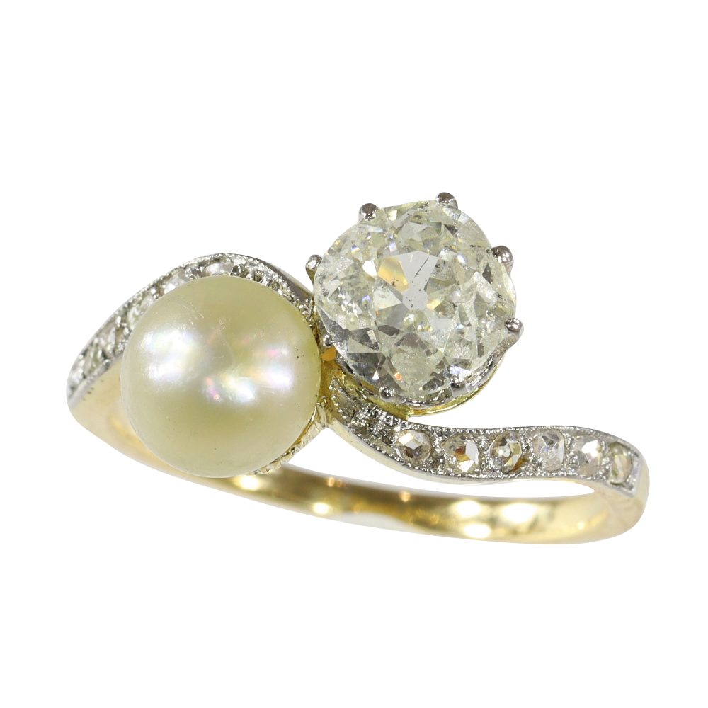 Antique Toi et Moi diamond and pearl in gold and platinum.
