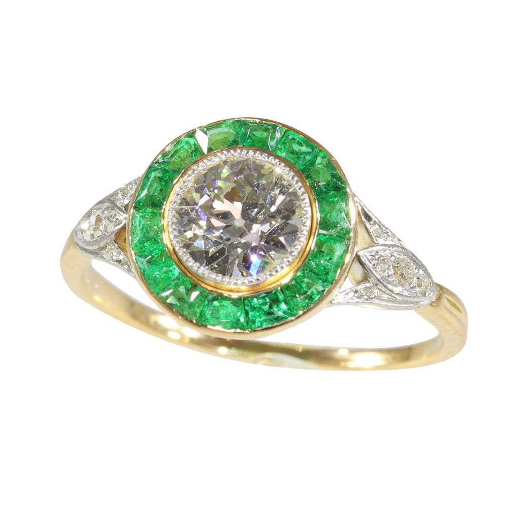 Art Deco diamond and emerald engagement ring in yellow gold and platinum.