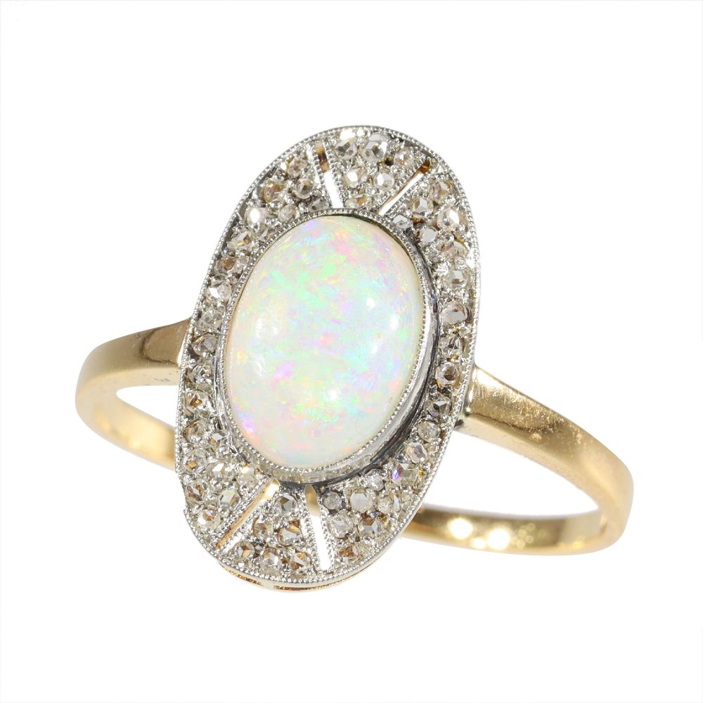 Antique opal and diamond ring in platinum and gold.