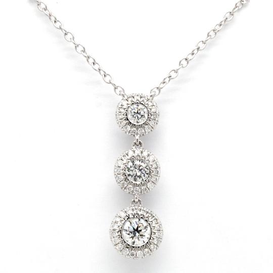 Diamond Trilogy Cluster Pendant Necklace; three brilliant-cut diamonds, collet-set, with a surround of pavé-set diamonds, 0.63ct total, 18ct white gold