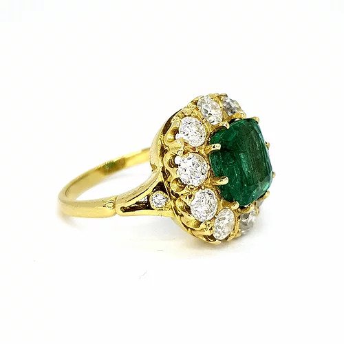 Emerald and Diamond Cluster Ring; central 3.65 carat cushion-cut emerald surrounded by 1.75cts sparkling diamonds, in 18ct yellow gold