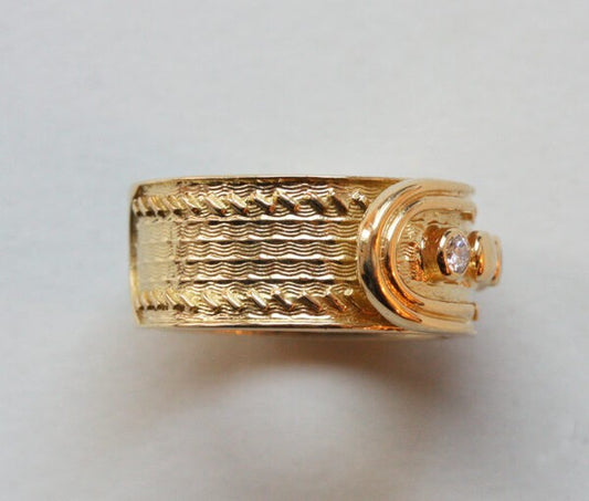 Kutchinsky Vintage Diamond and 18ct Yellow Gold Buckle Ring; geometrical and wave pattern, four buttons of which three are set with diamonds. Signed Kutchinsky, London, 1969