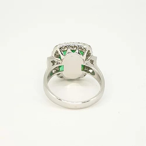 4.18ct Emerald Cut Emerald and Diamond Cluster Ring in 18ct white gold with heart detailing to under-mount